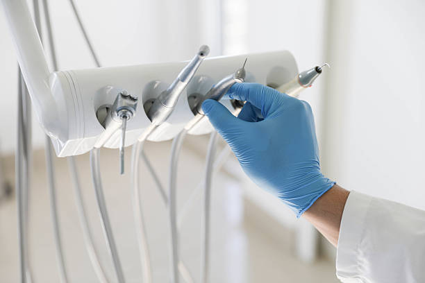 Professional Tooth Extraction technician working in Oak Grove, LA